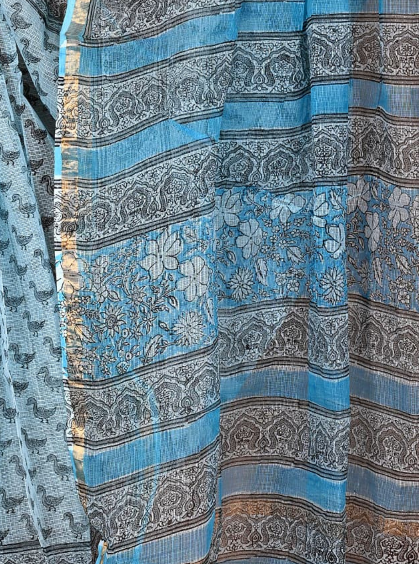 Sky Blue Kota Doria Saree with Swan Motifs & Floral Ajrakh-Inspired Pallu