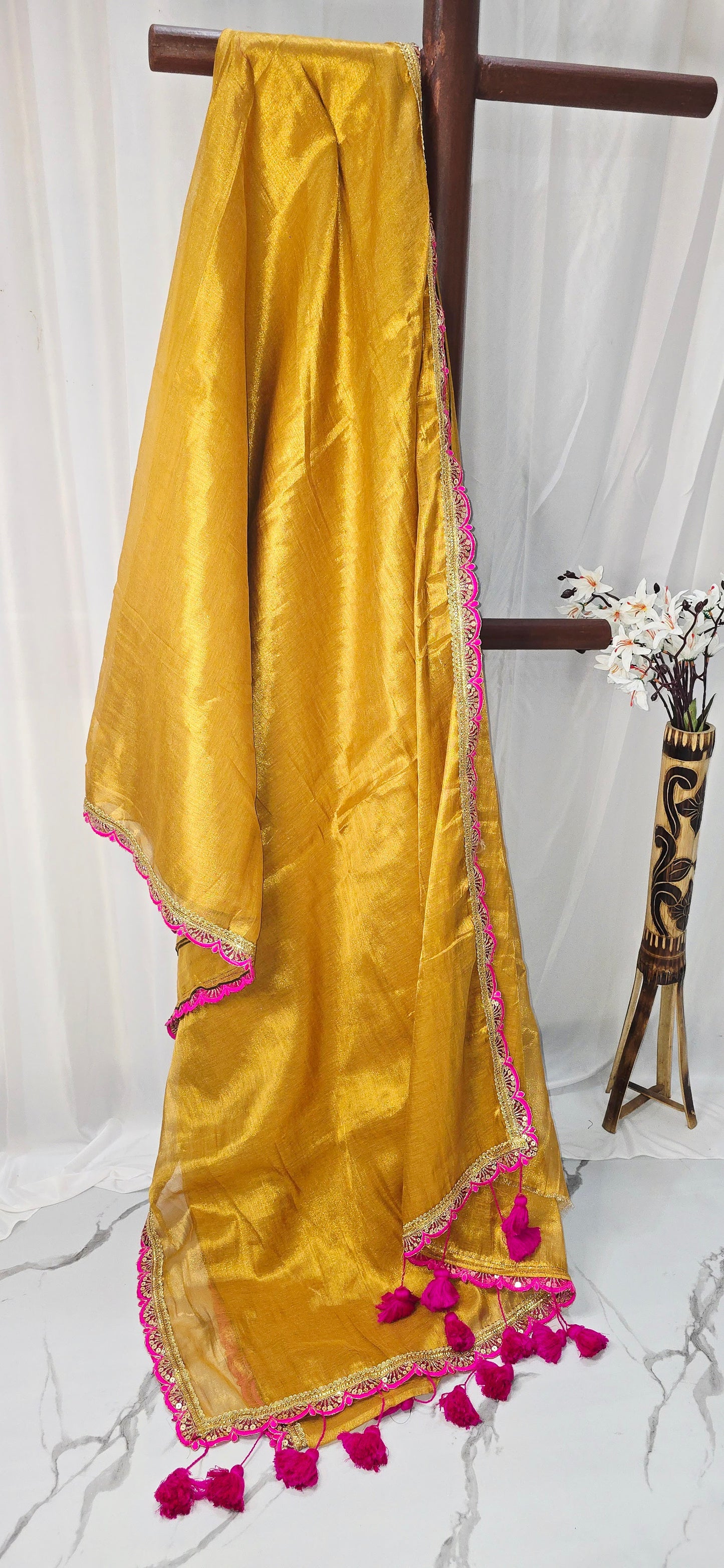 Golden Tissue Saree with Pink Lace Embroidery & Tassels – Festive Ethnic Wear