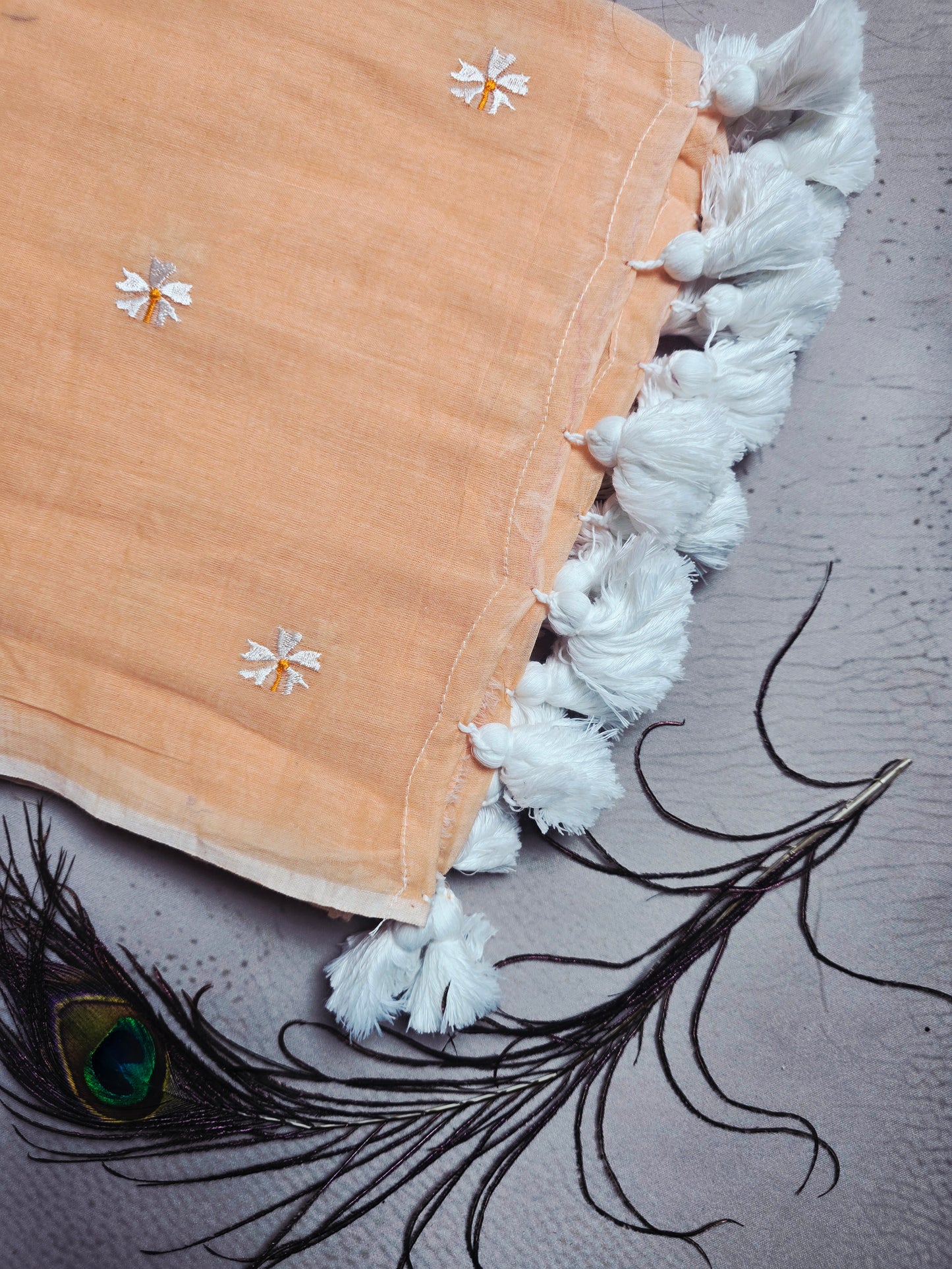 Peach Blush Mul Cotton Saree with Daisy Embroidery & Handcrafted White Tassels