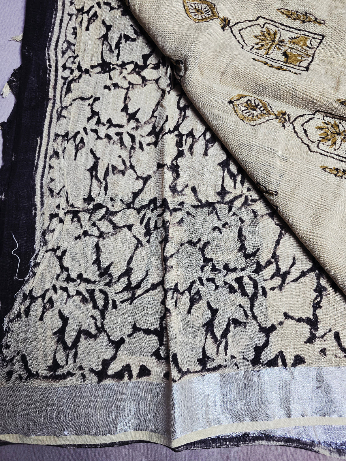 Ivory Linen Cotton Saree with Golden Lotus Motifs, Black Floral Borders & Navy Floral Accents
