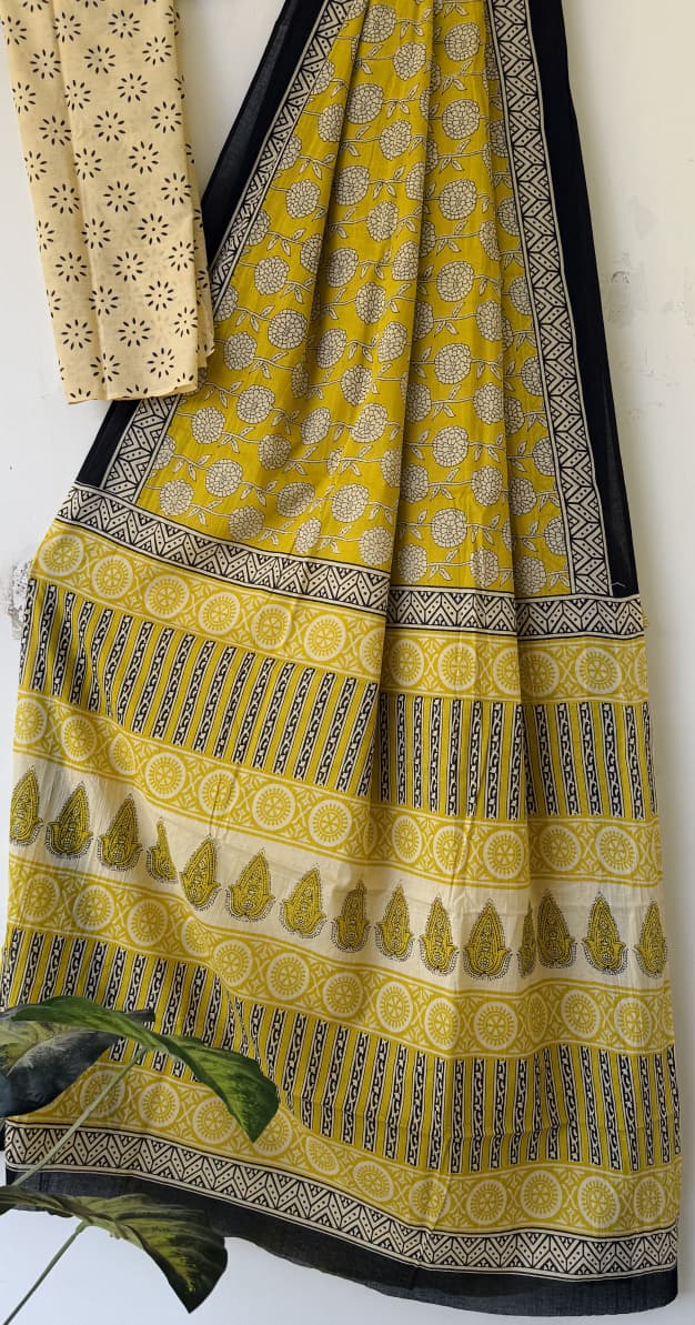 Mustard yellow cotton saree with cream floral motifs and black geometric border