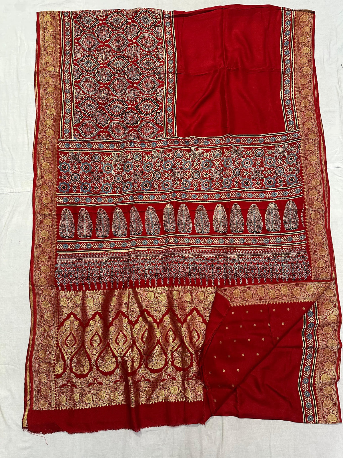 Mustard yellow Dola silk Ajrakh handblocked saree with multicolour geometric triangle pattern and gold border