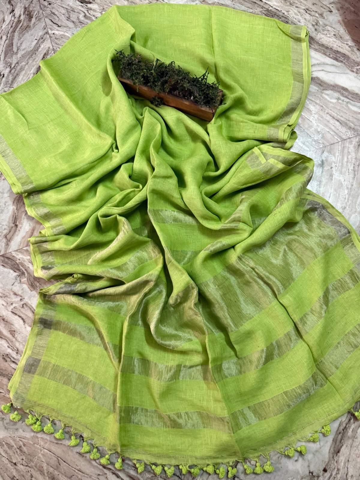 Lime green linen cotton handloom saree with metallic border and matching green tassels