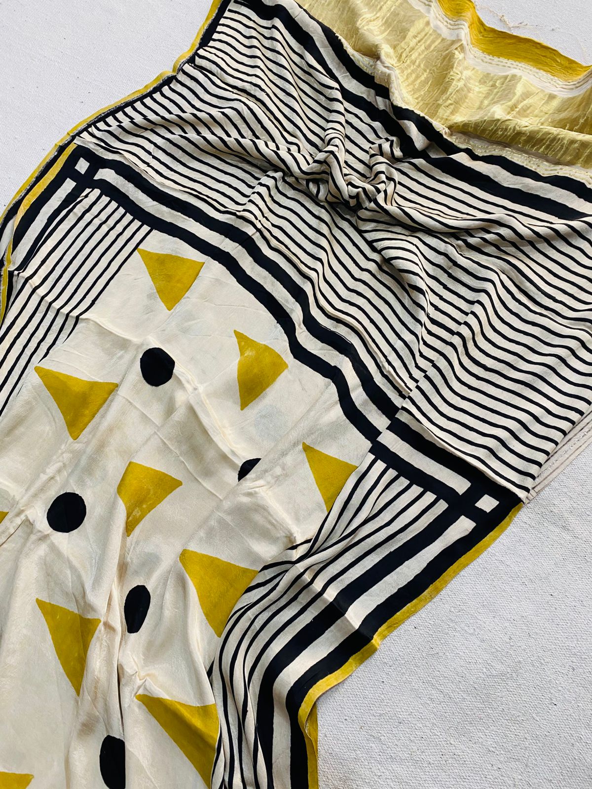 Ivory Modal Gajji silk saree with mustard-yellow triangles, black dots, black ivory striped border and mustard edging