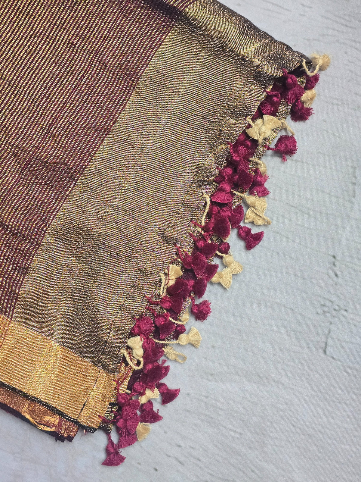 Deep wine Mul Cotton saree close-up with zari and tassels