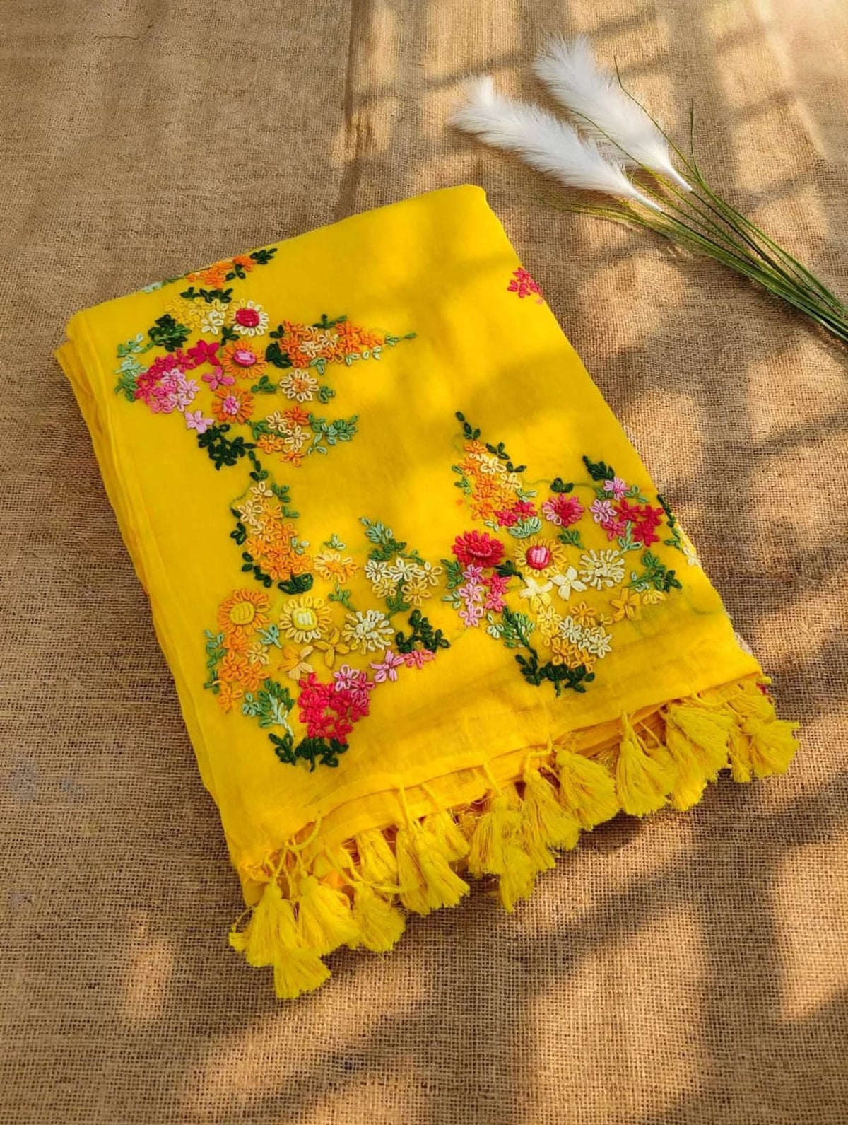 Mustard yellow mul cotton saree with multicolour floral embroidery and yellow tassels