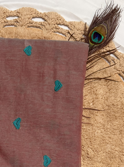 Subtle Dusty Pink Mul Cotton Saree with Minimal Embroidery & Green Tassels