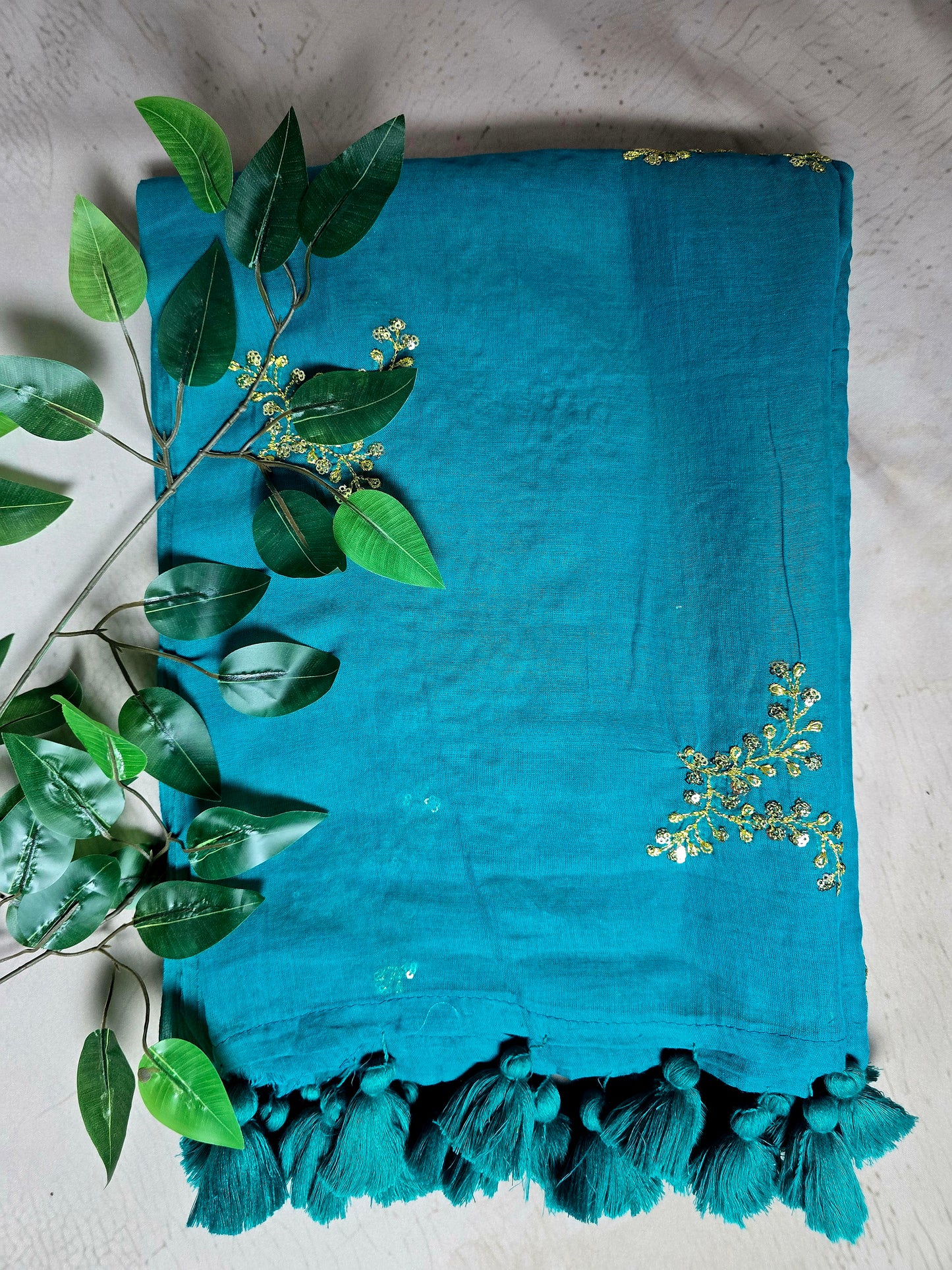 Peacock Blue Mul Cotton Saree with Golden Floral Embroidery & Matching Tassels