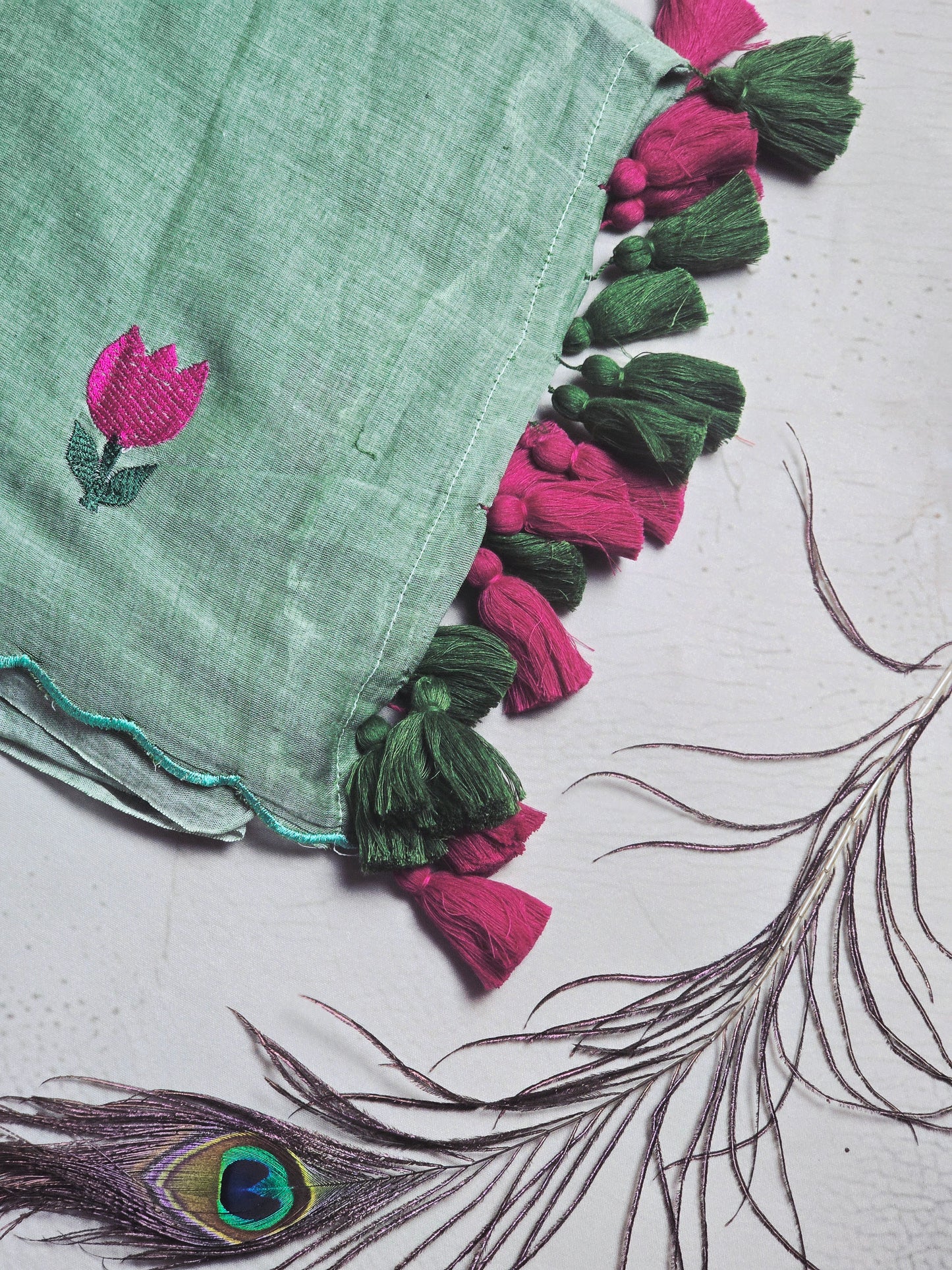 Mint Green Embroidered Tulip Mul Cotton Saree with Green & Magenta Tassels