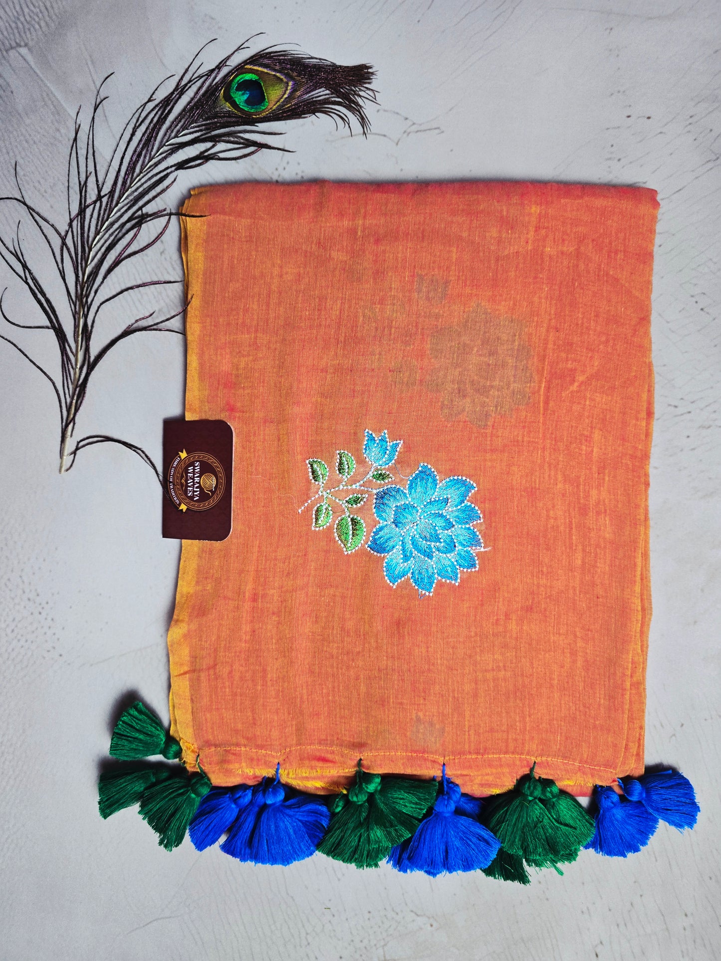 Sunset Orange Embroidered Floral Mul Cotton Saree with Royal Blue & Emerald Green Tassels