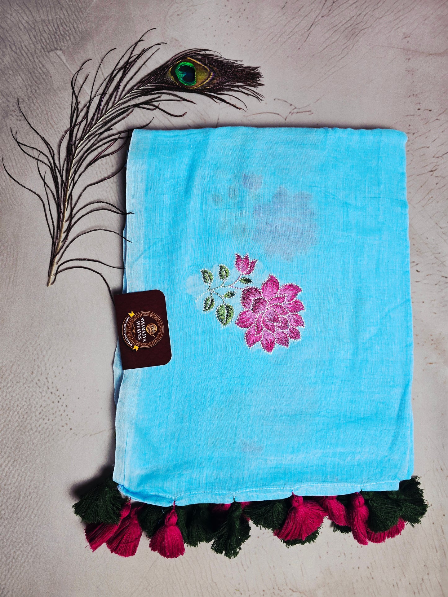 Sky Blue Embroidered Floral Mul Cotton Saree with Deep Green & Magenta Tassels