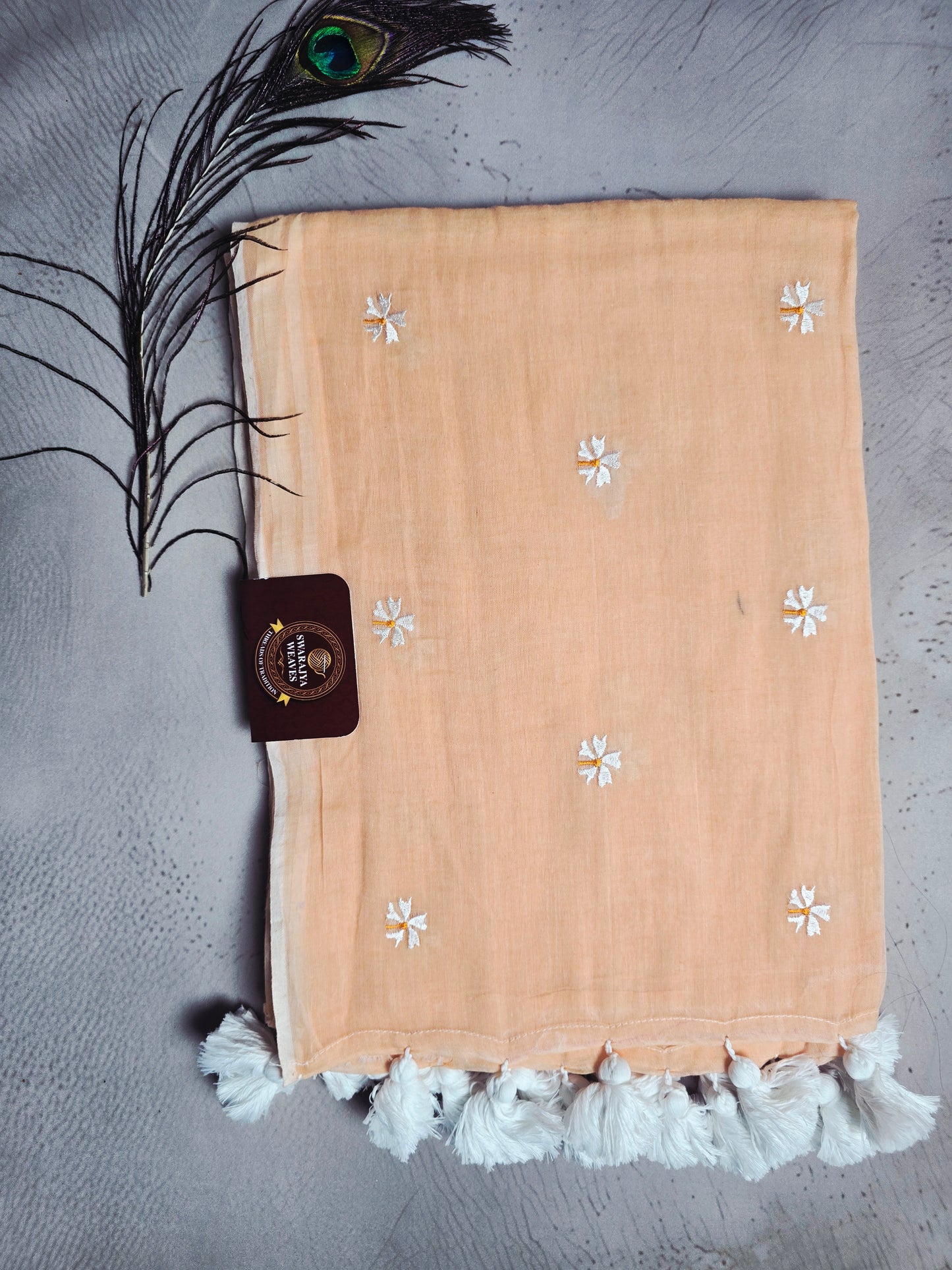 Peach Blush Mul Cotton Saree with Daisy Embroidery & Handcrafted White Tassels