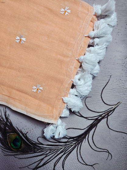 Peach Blush Mul Cotton Saree with Daisy Embroidery & Handcrafted White Tassels