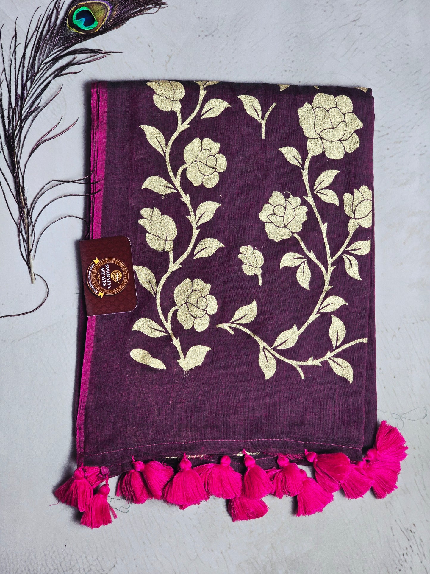 Wine Mul Cotton Saree with Golden Floral Print & Fuchsia Handcrafted Tassels