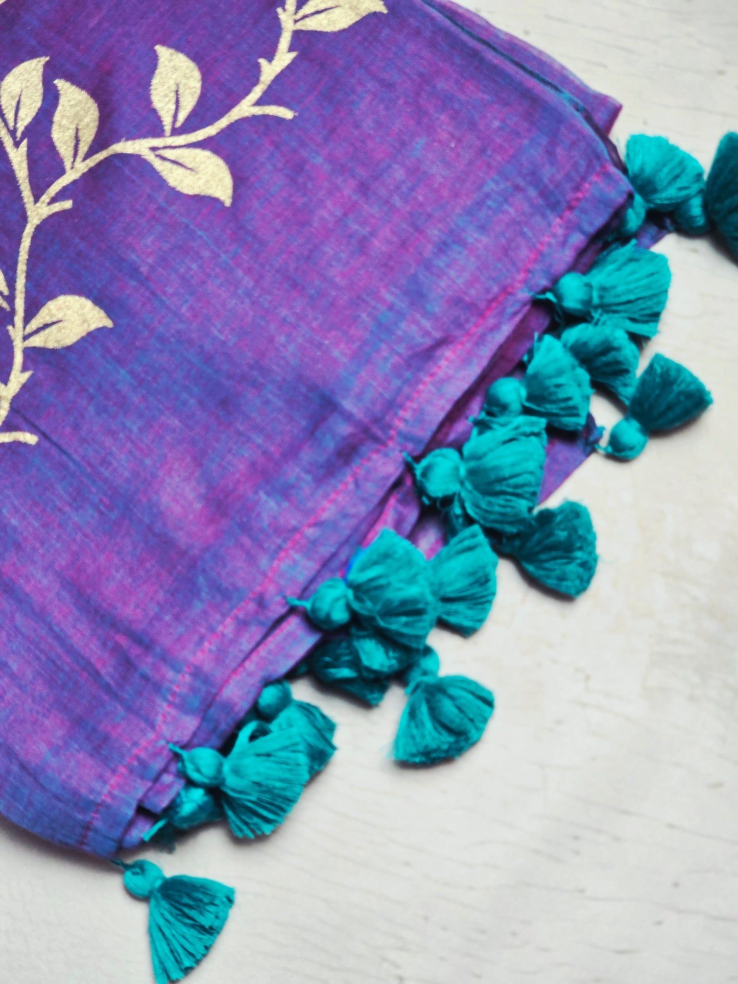 Royal Purple Mul Cotton Saree with Golden Floral Print & Teal Tassels