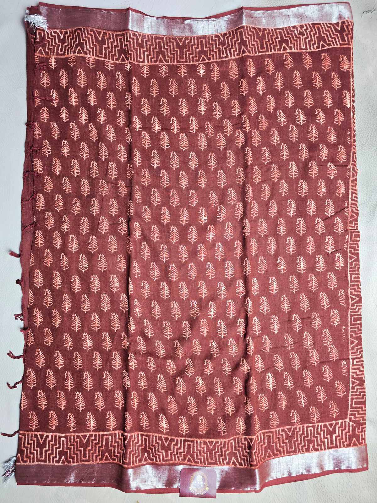 Rustwood Leaf Linen Cotton  Saree with Peach Motifs & Geometric Border