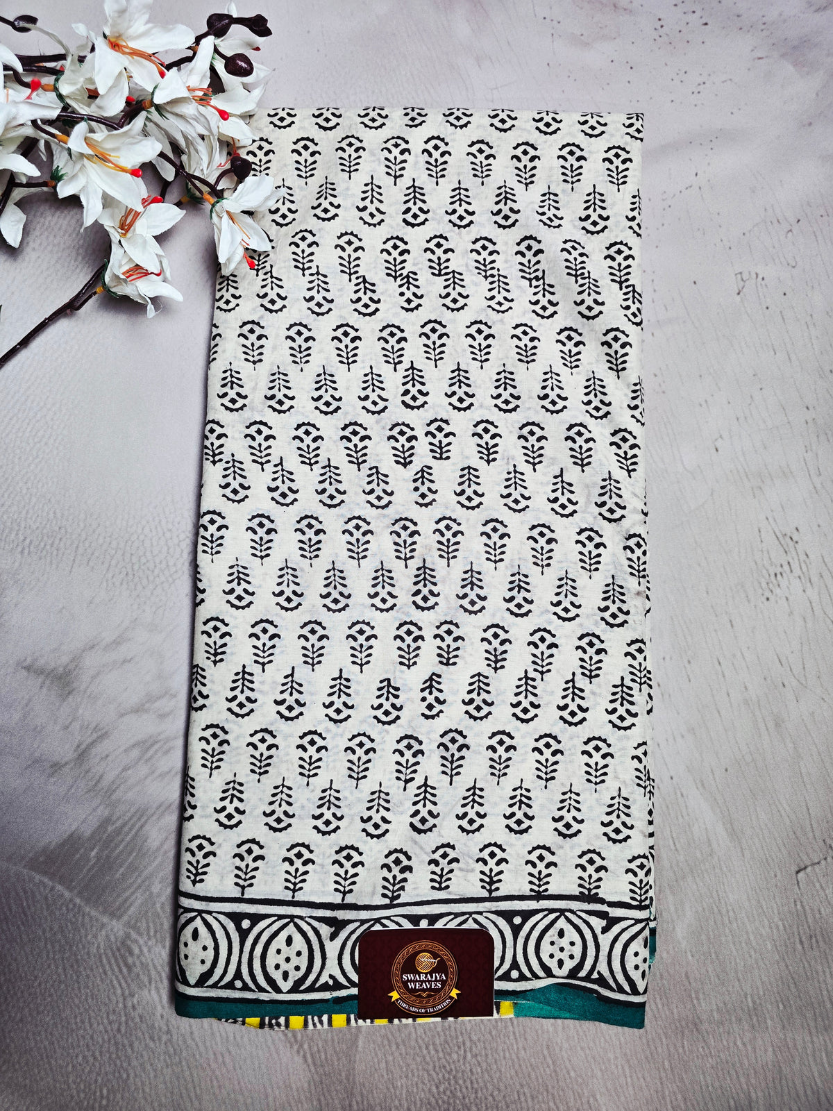 White & Black Cotton Bagru Handblock Saree with Botanical Motifs, Teal Border & Yellow Accents