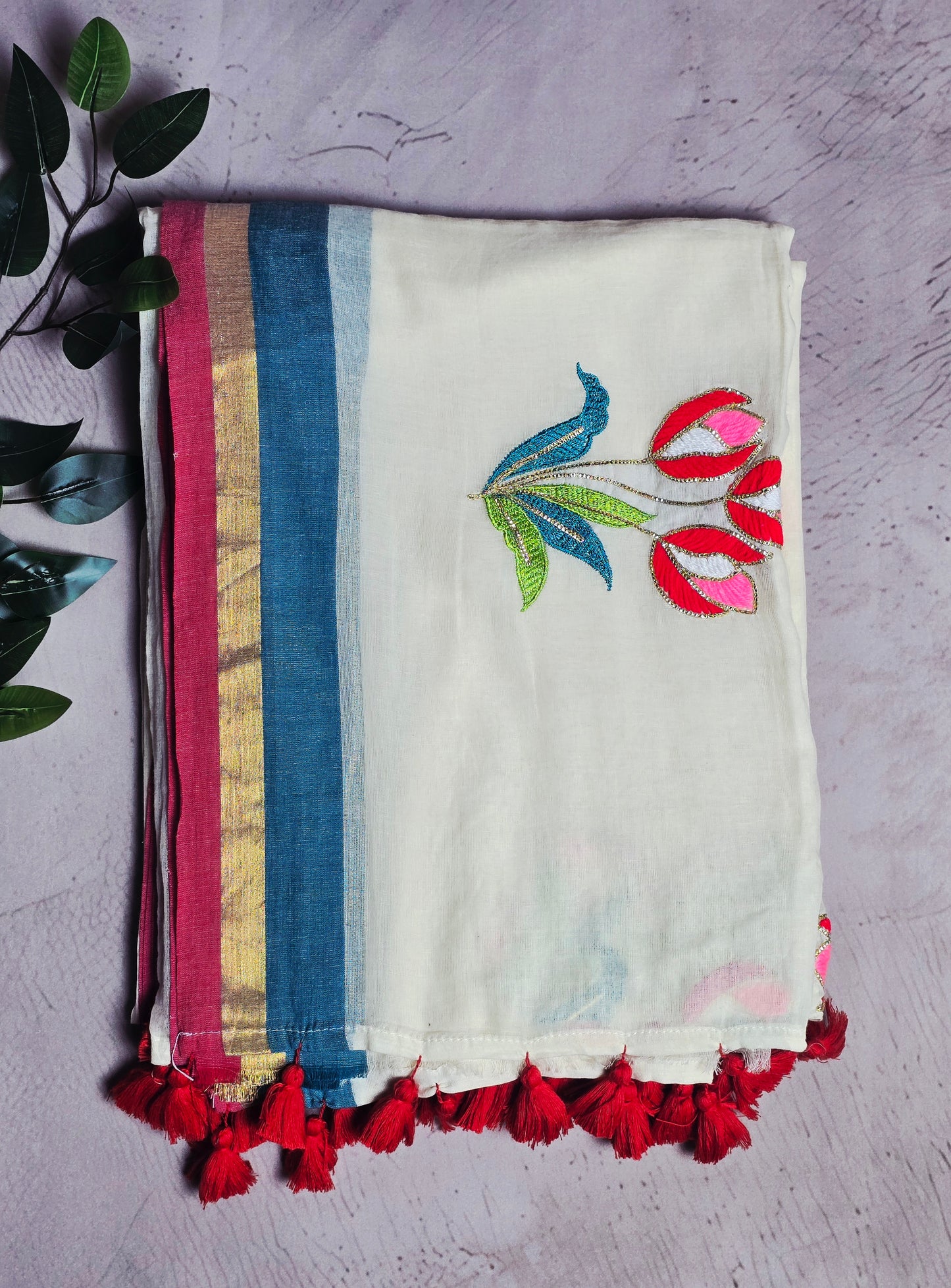 Ivory and Blue Mul Cotton Saree with Multicolour Floral Embroidery & Red Tassels