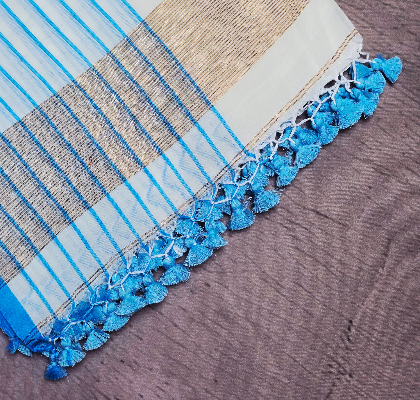 Ivory and Cyan Blue Mull Cotton Saree with Gold Zari Panels & Blue Tassels