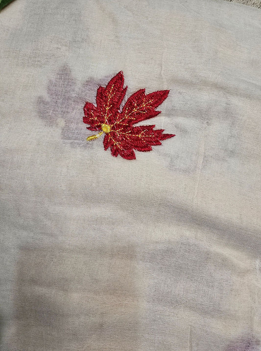 Ivory Mul Cotton Saree with Red Floral Embroidery & Gold Tassels