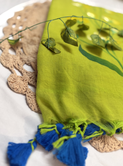 Refreshing Lime Green Hand-Painted Mul Cotton Saree with Floral Art & Blue Tassels