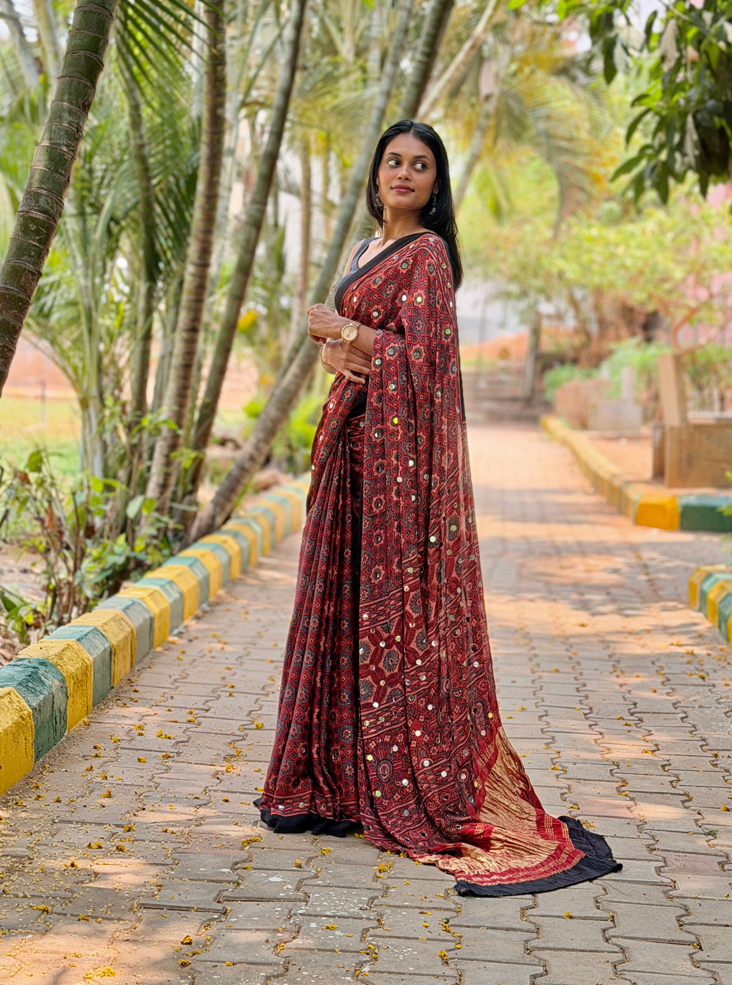 Rust Red Modal Silk Saree with Mirror Work & Ajrakh-Inspired Prints