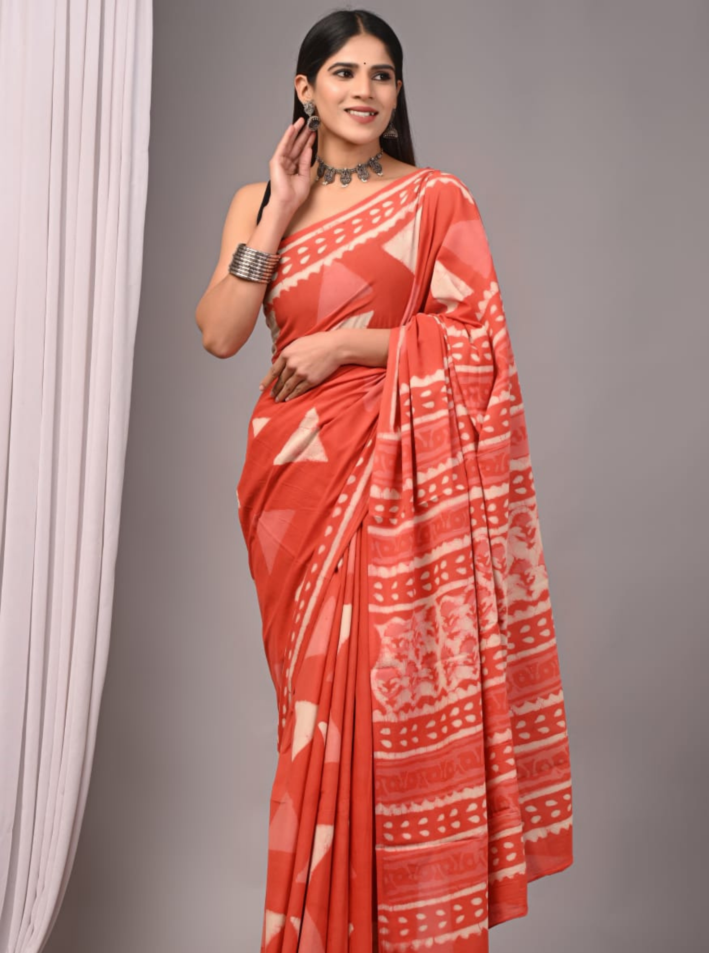 Rust Orange Cotton Saree with Tribal Prints & Ethnic Border