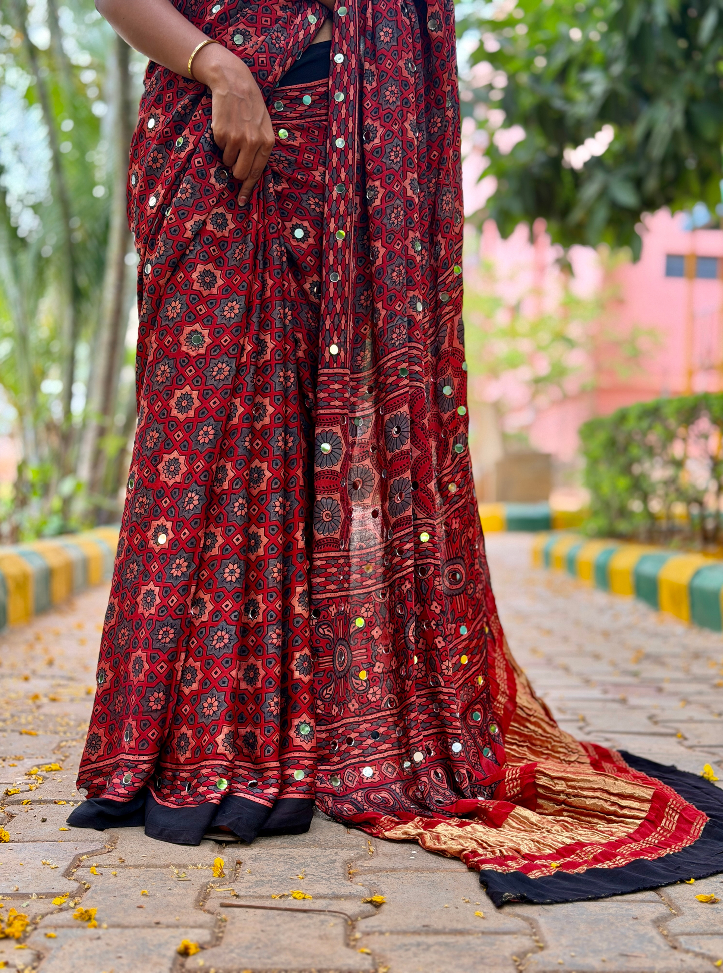 Rust Red Modal Silk Saree with Mirror Work & Ajrakh-Inspired Prints