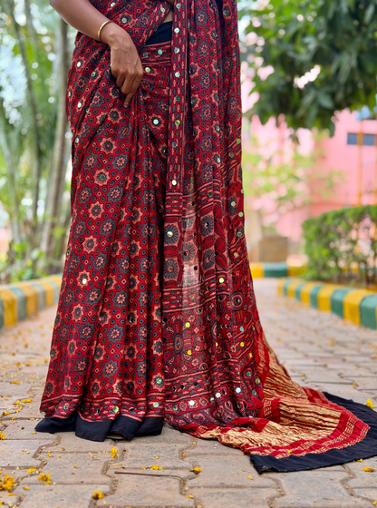 Rust Red Modal Silk Saree with Mirror Work & Ajrakh-Inspired Prints
