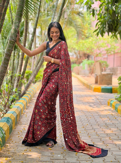 Rust Red Modal Silk Saree with Mirror Work & Ajrakh-Inspired Prints