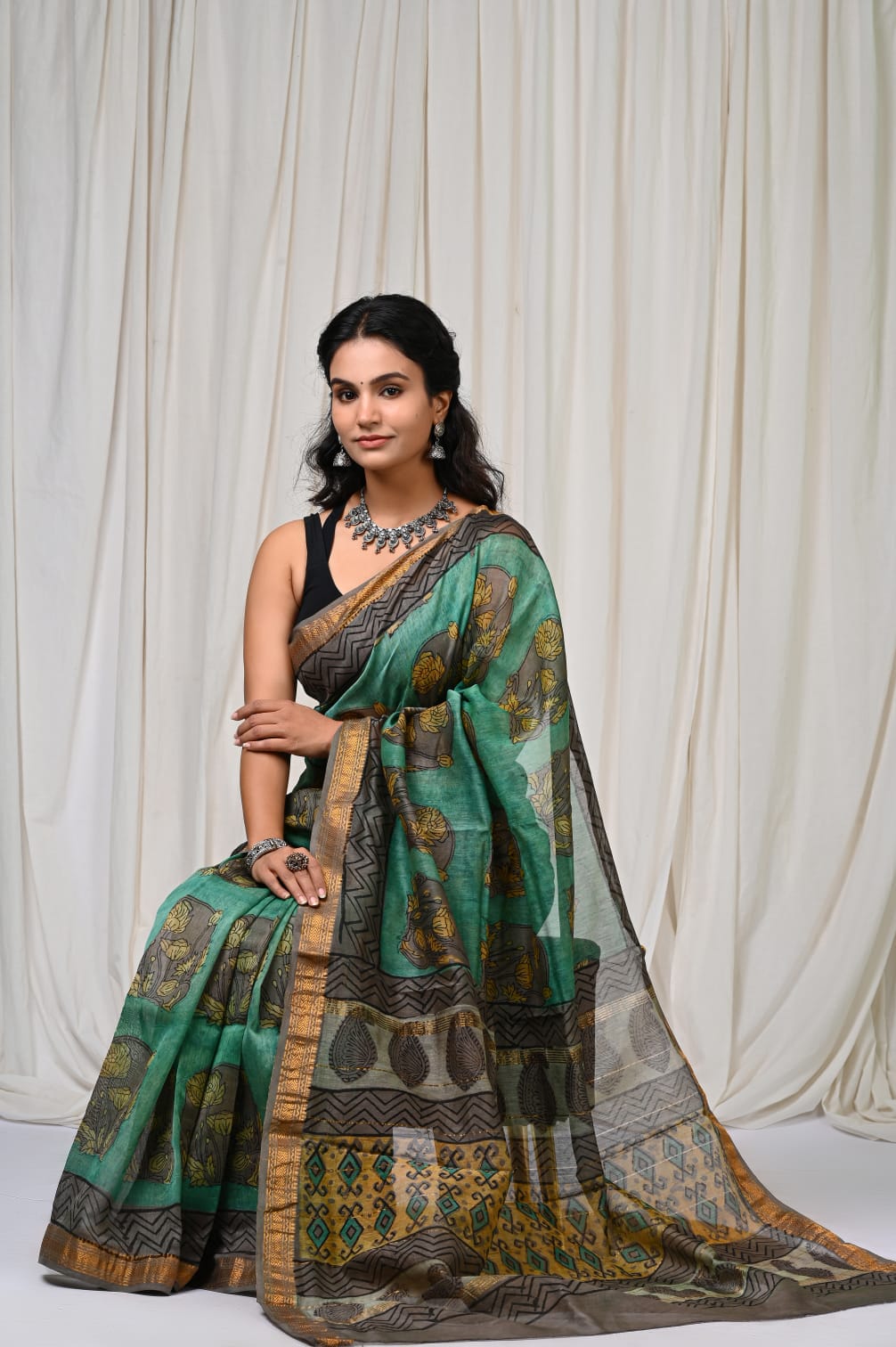 Bottle Green Maheshwari Silk Ajrakh Saree – Grey Pallu & Gold Border