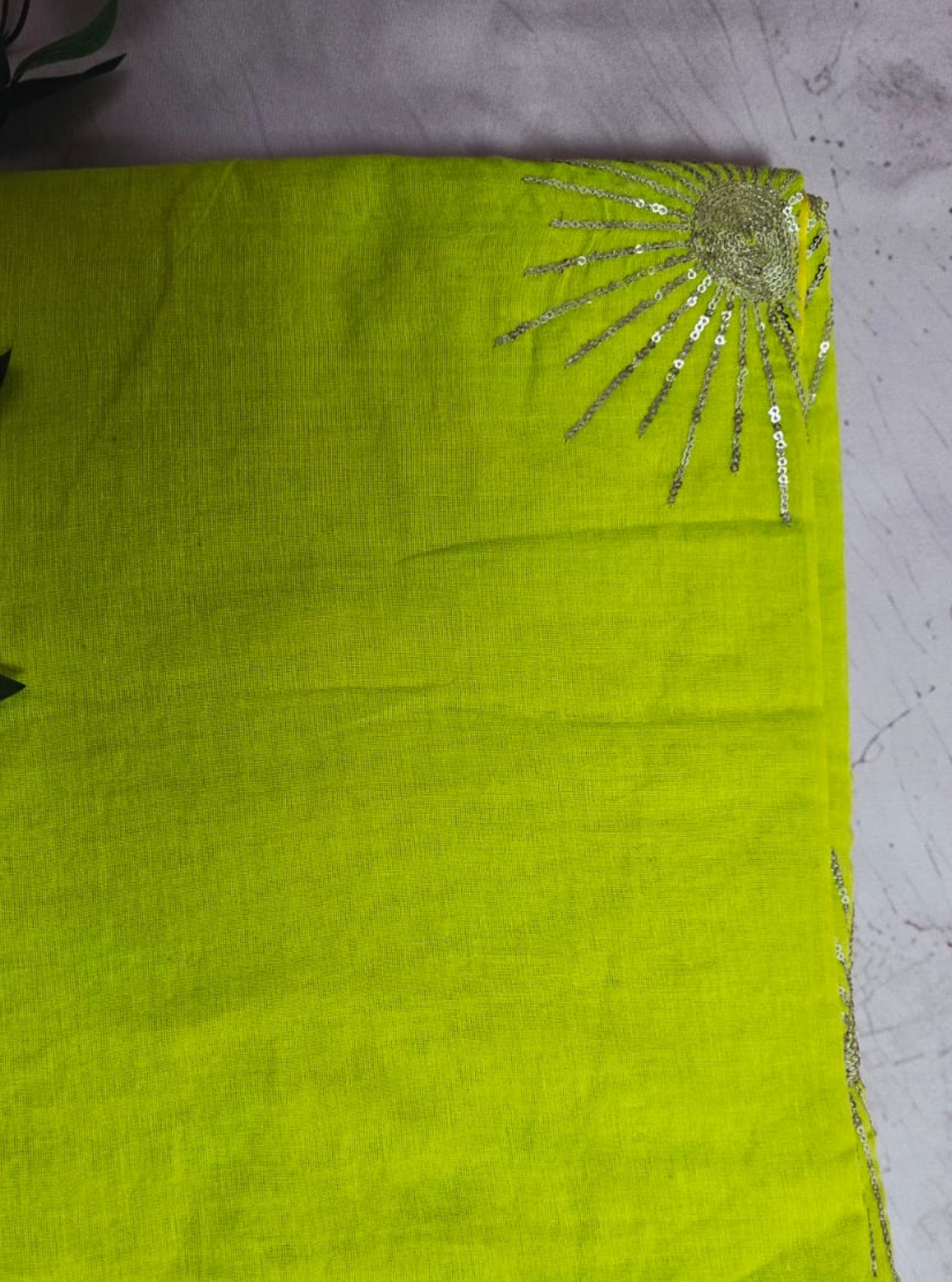 Lime Yellow Mul Cotton Saree with Hand Embellished Sun Motif