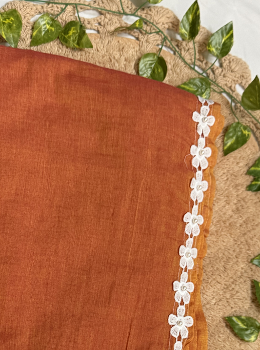 Rust Orange Mul Cotton Saree with White Floral Lace Border & Contrast Tassels