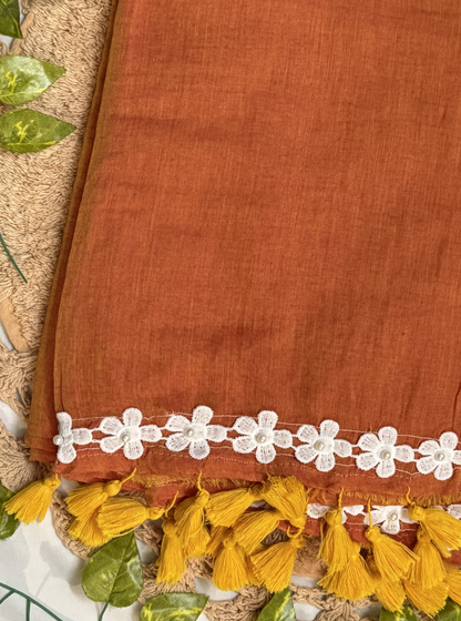 Rust Orange Mul Cotton Saree with White Floral Lace Border & Contrast Tassels