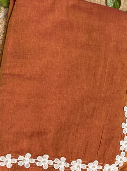 Rust Orange Mul Cotton Saree with White Floral Lace Border & Contrast Tassels
