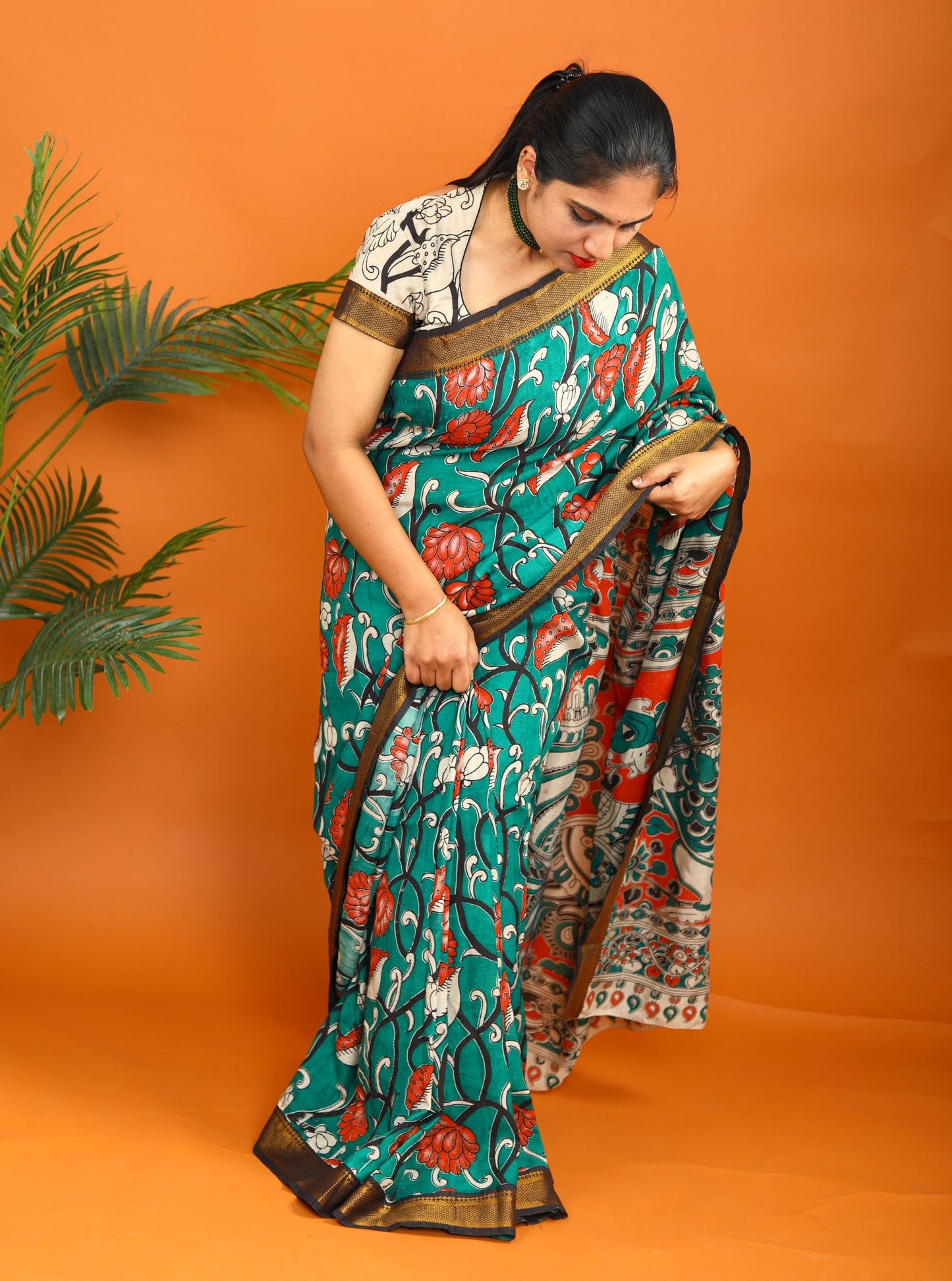 Teal Green Kalamkari Saree with Traditional Floral Print & Contrast Border