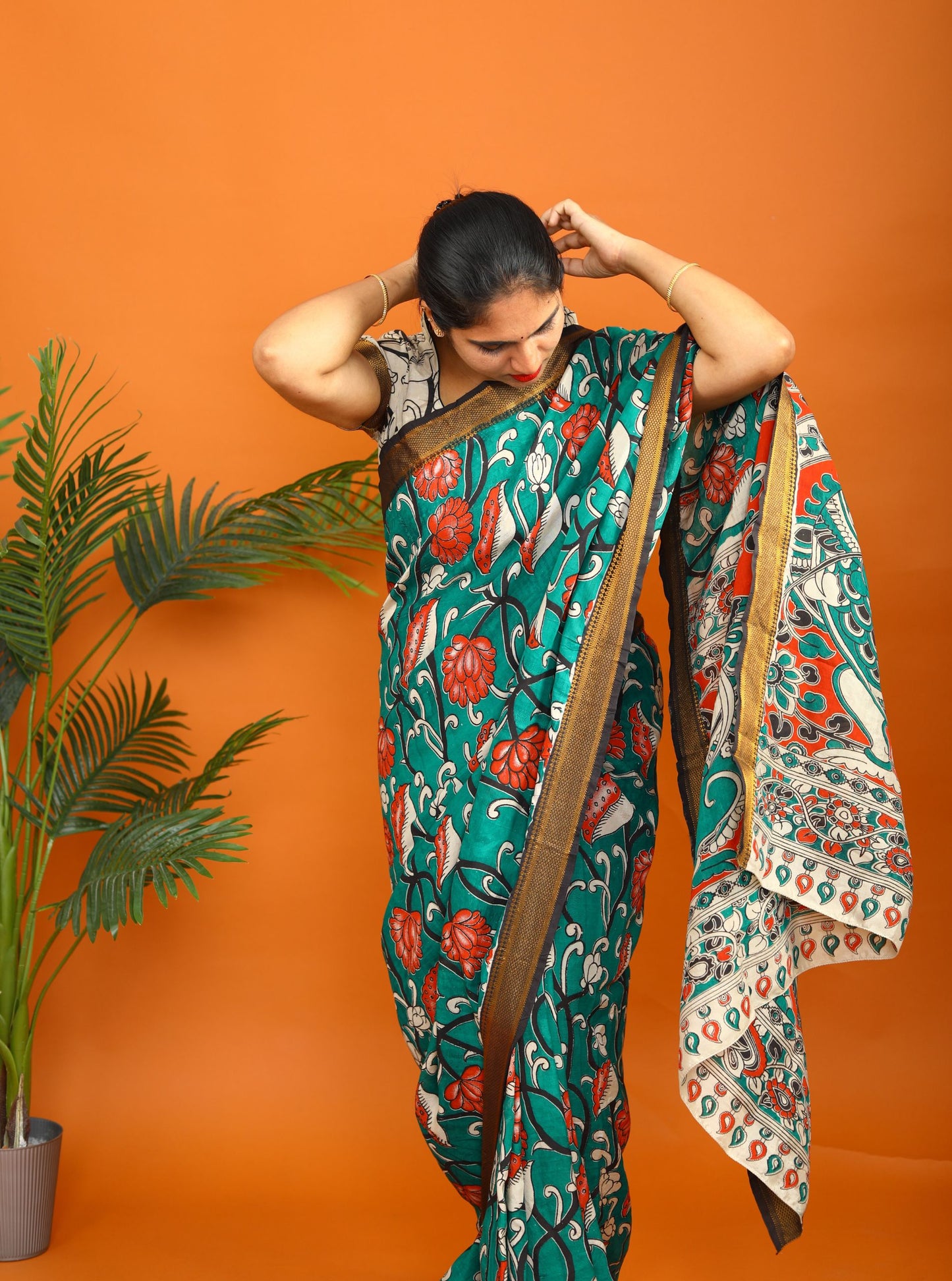 Teal Green Kalamkari Saree with Traditional Floral Print & Contrast Border