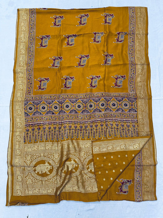 Mustard yellow Dola silk Ajrakh handblocked saree with elephant motifs and ornate gold border