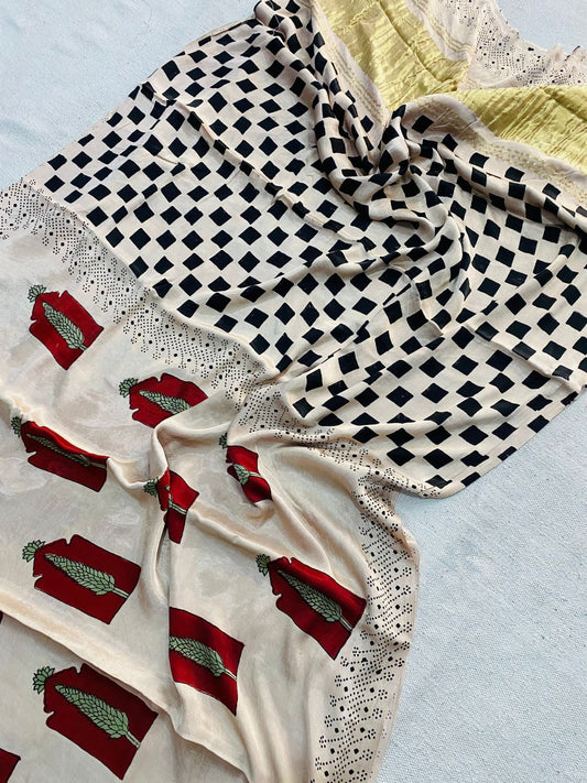 Ivory Modal Gajji silk saree with black diamond motifs, red rectangular motifs with green detailing, dotted border and pale gold pallu