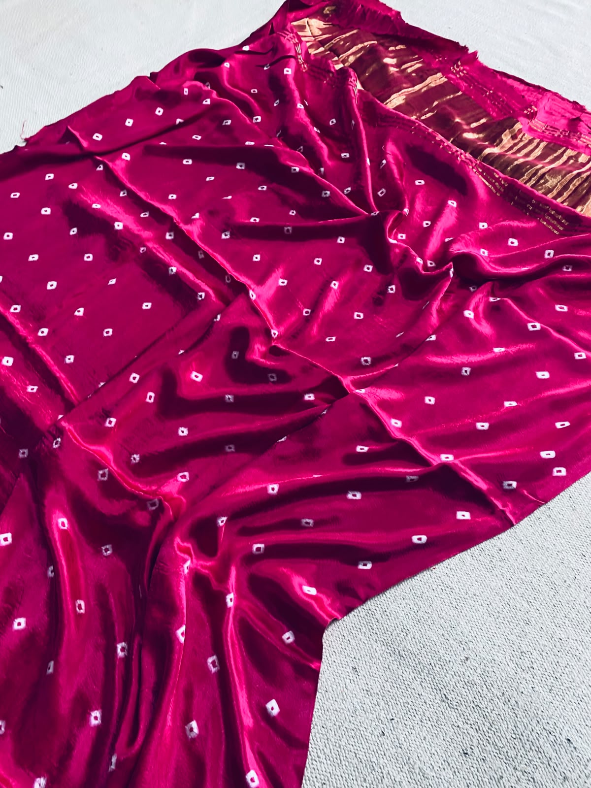 Deep magenta Modal Gajji silk saree with white square motifs and copper-gold brown striped pallu