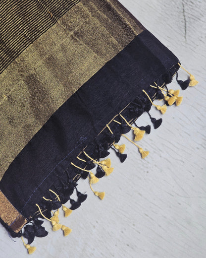 Deep navy Mul Cotton saree close-up with gold zari and tassels