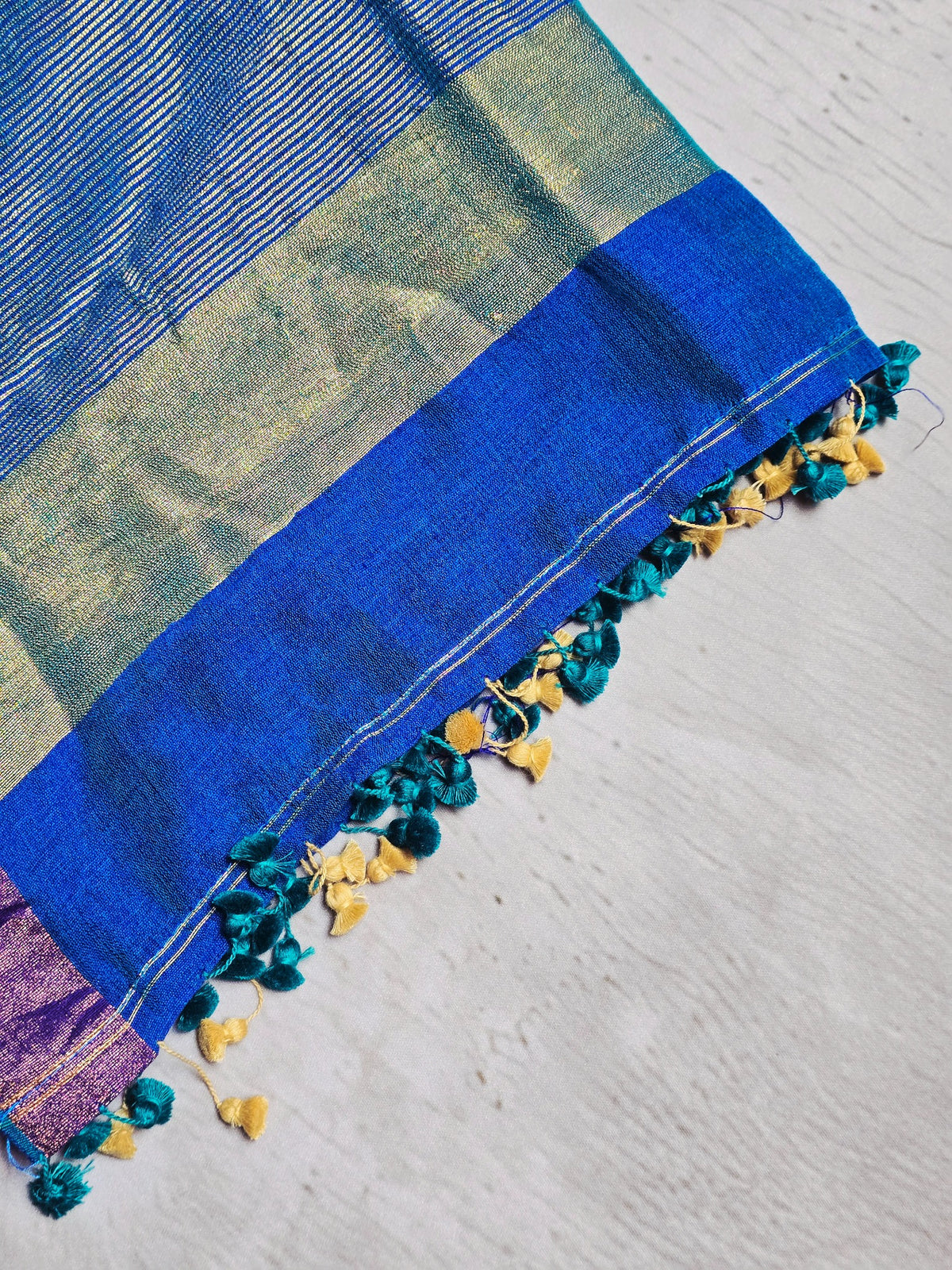 Royal blue Mul Cotton saree close-up with zari and tassels