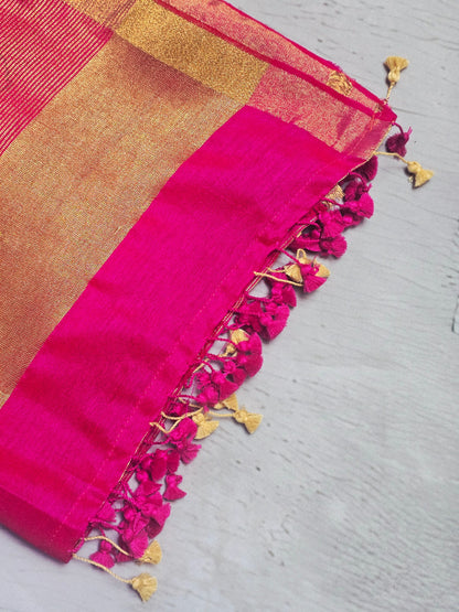 Vivid fuchsia pink Mul Cotton saree close-up with tassels and zari