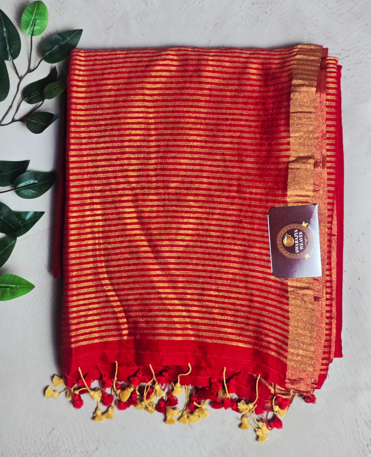 Vibrant red Mul Cotton saree with antique gold zari stripes and tassels