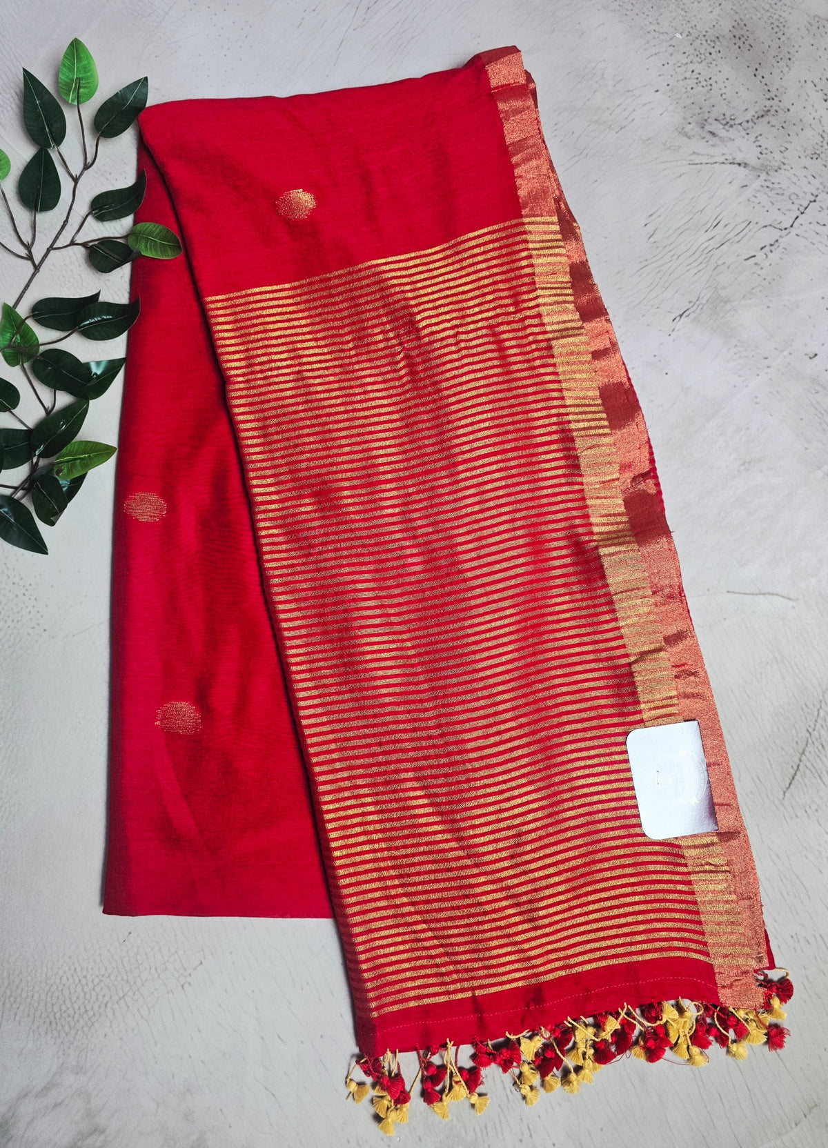 Vibrant red Mul Cotton saree with antique gold zari pallu and buta motifs