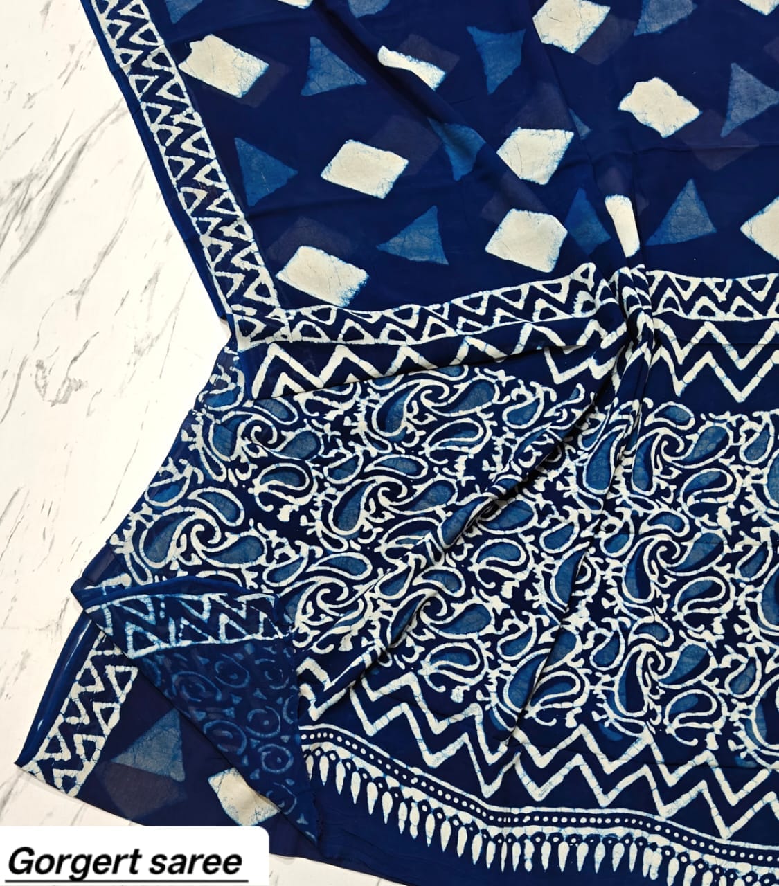 Navy blue georgette saree with ivory geometric motifs and paisley printed pallu