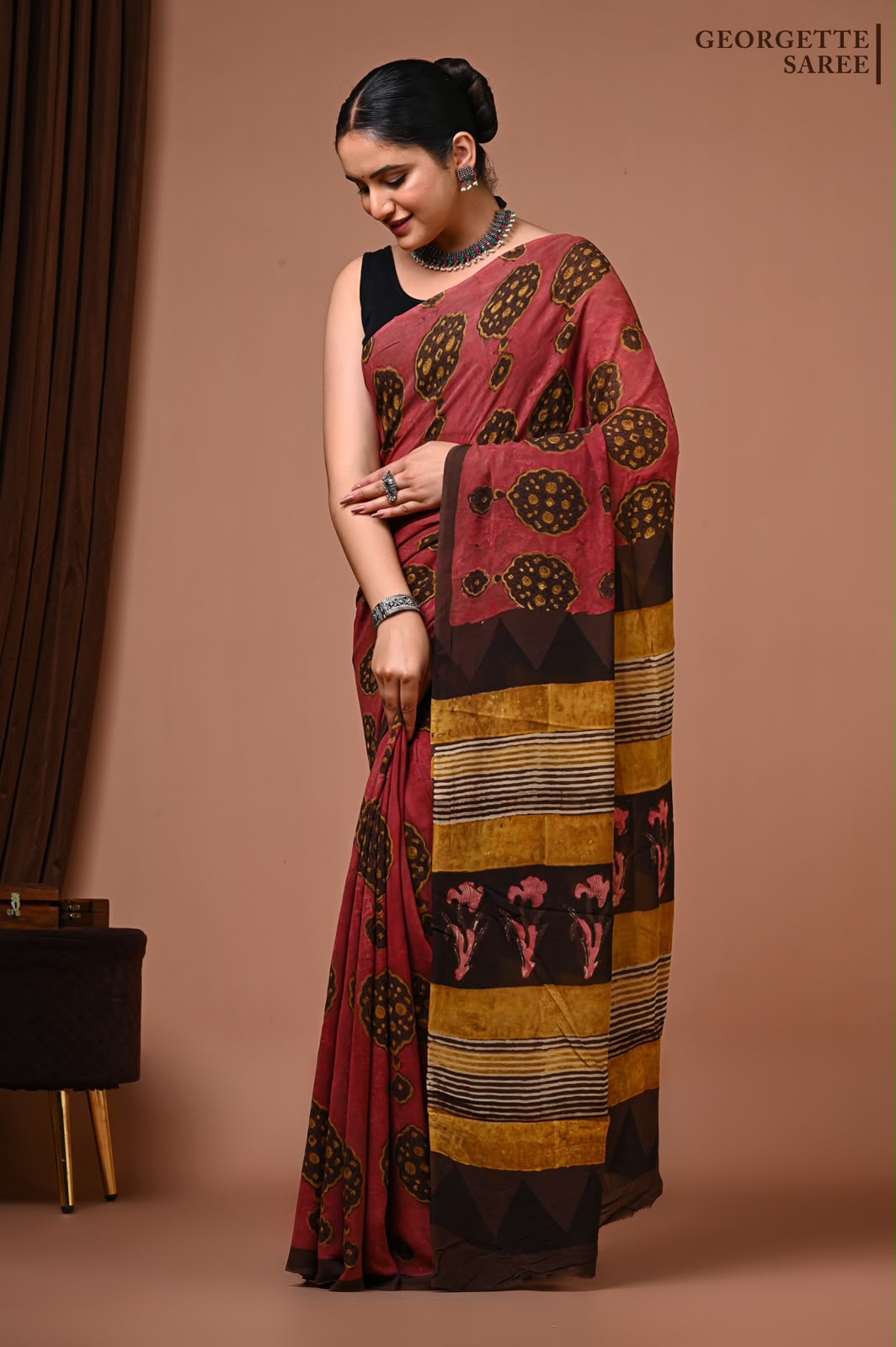 Maroon Georgette Ajrakh saree with mustard and brown motifs