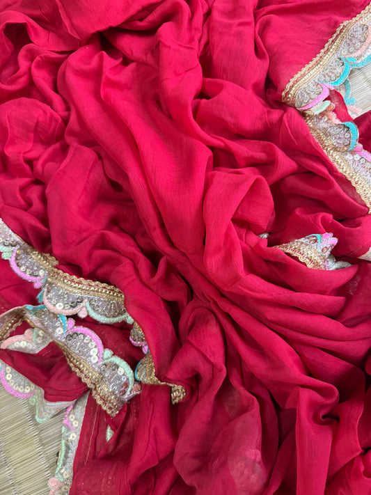 Raspberry pink mul cotton saree with ornate gold, silver and pastel decorative lace border